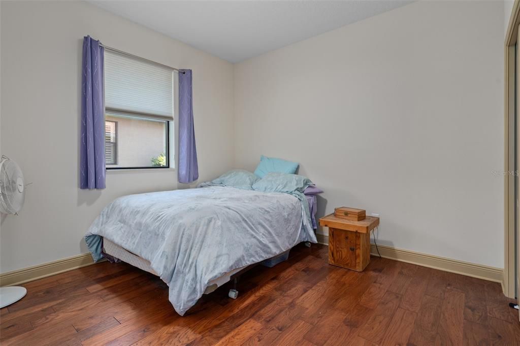 This bedroom is Light and bright with a large closet