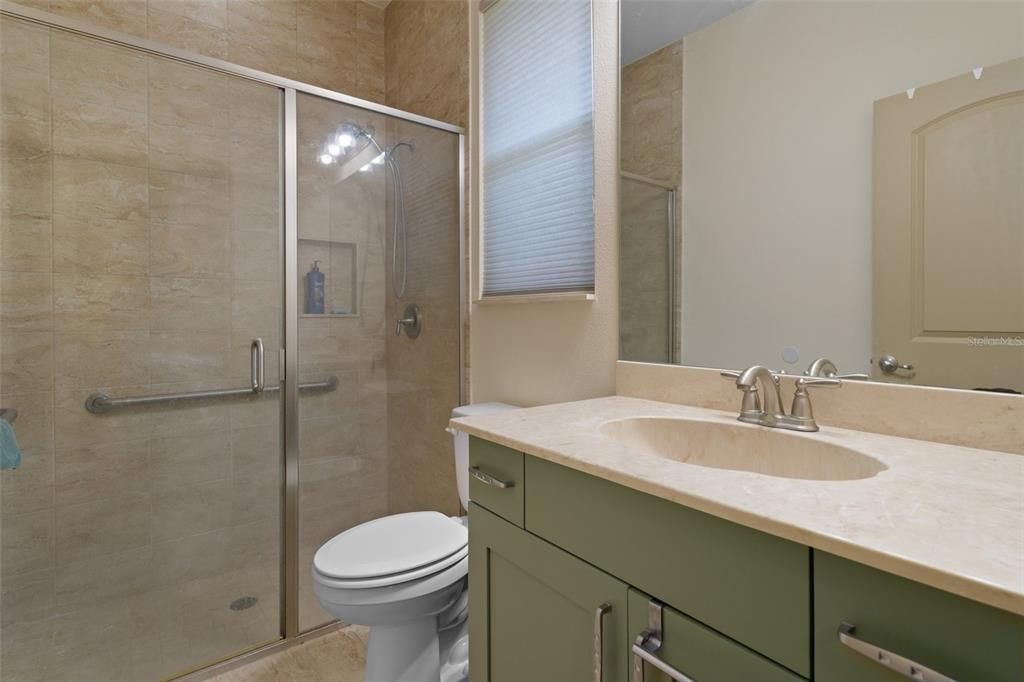 Beautifully tiled shower and Lovely Vanity in the Second Guest Bedroom