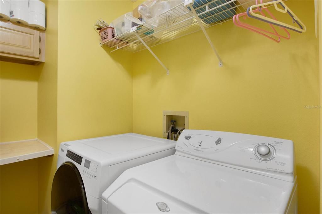 Interior Laundry room w/ Cabinets & Wire Rack