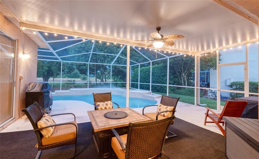 The screened in pool offers additional entertainment space