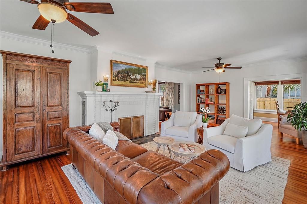 Living room offers lots of natural light to display your art