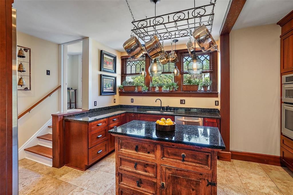 Built-in dry bar in the kitchen can also double as a walk-in pantry.