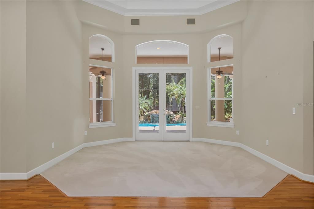 Living room and doors to patio and pool