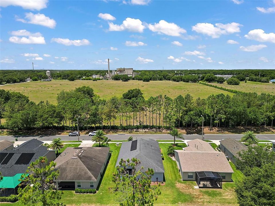 View from front of home .. The Building with the Stack, is Covanta. No VOC's  go into the air, no soot or smoke nor ash. They are collecting our Garbage and Saving the Earth by replacing the Dumps that have destroyed our earth.