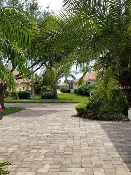 The view from your front doorway. Plenty of mature landscaping with a waterfront setting beyond. "Far better" than average.