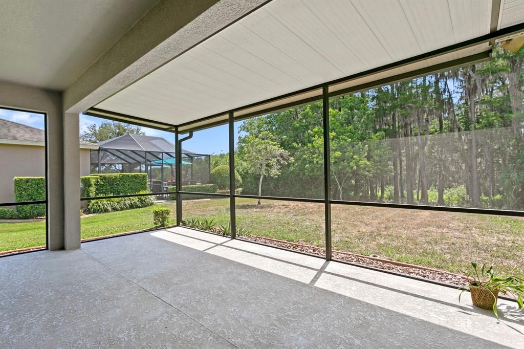 Enjoy sunset views through the cypress forest from your spacious backyard lanai