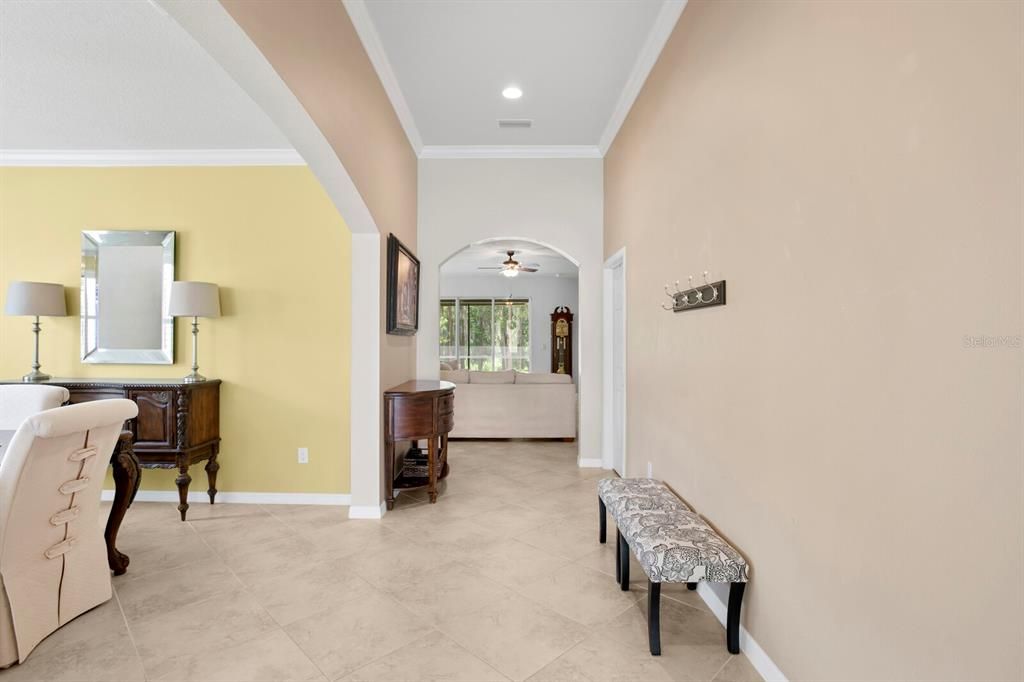 Foyer extends from the dining room down towards the family room and kitchen