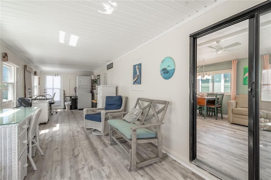 Sliding glass doors lead to the fForida room, with wood laminate flooring.