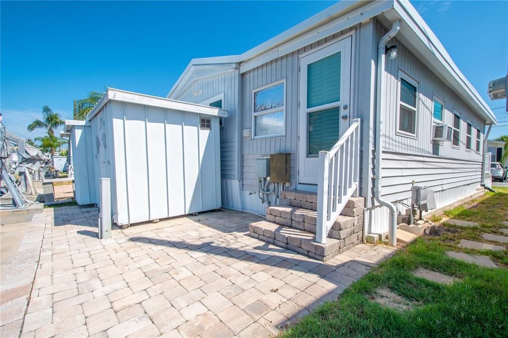 The home features a stone paver patio.