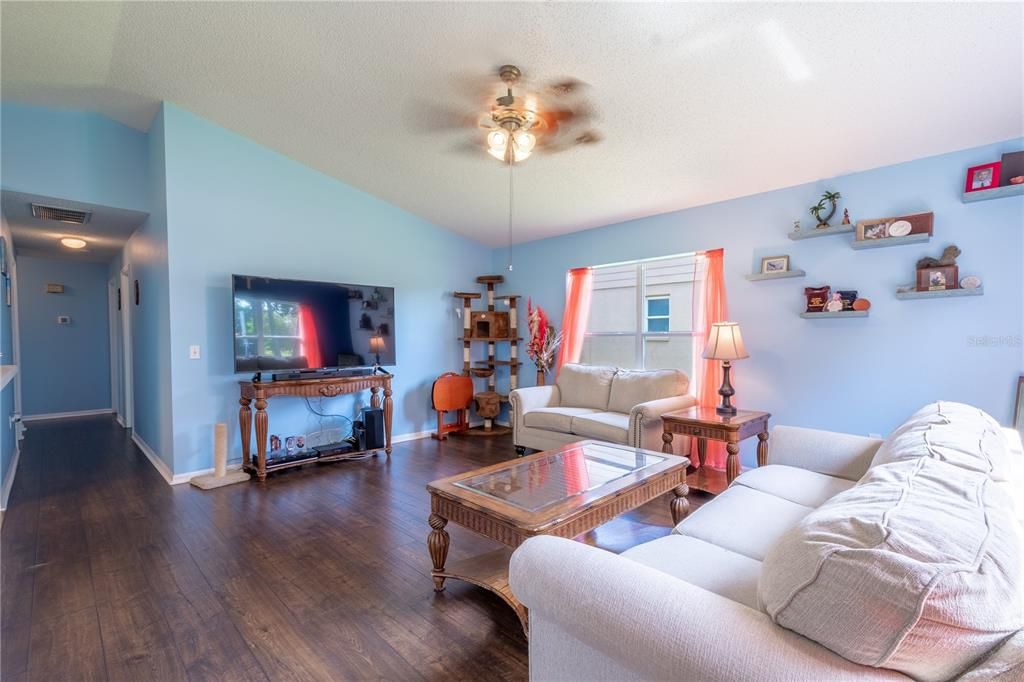 The family room features a ceiling fan with light kit.