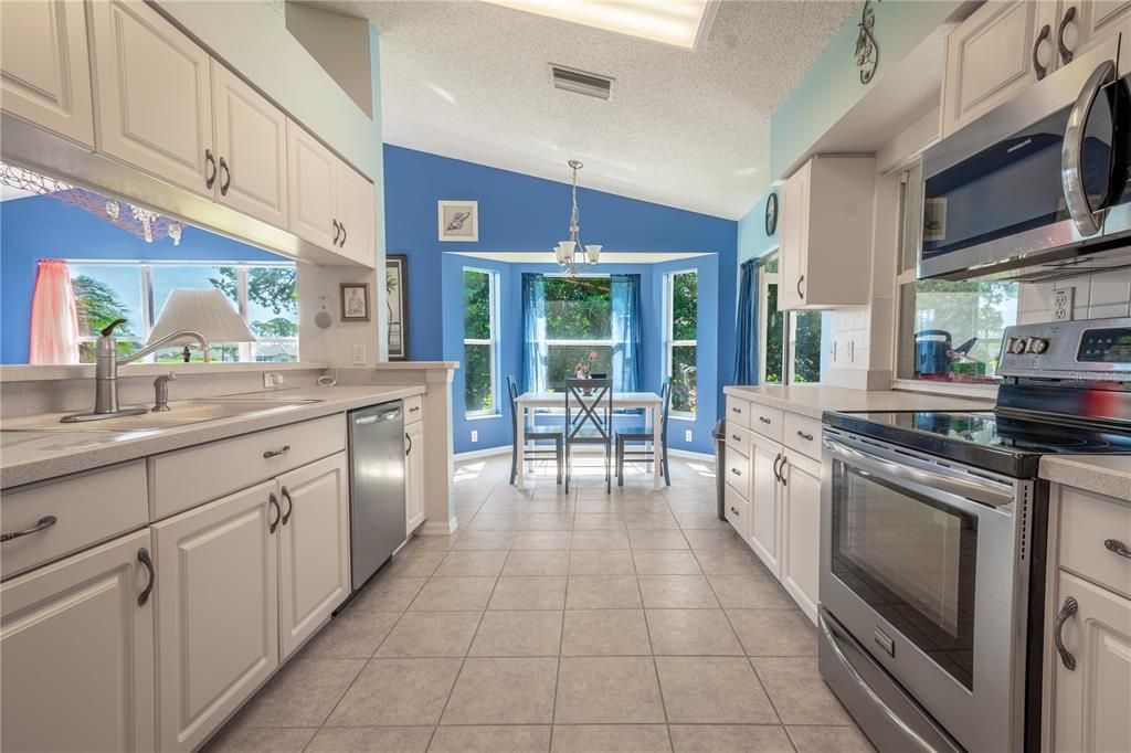 The galley kitchen features a suite of stainless steel appliances.