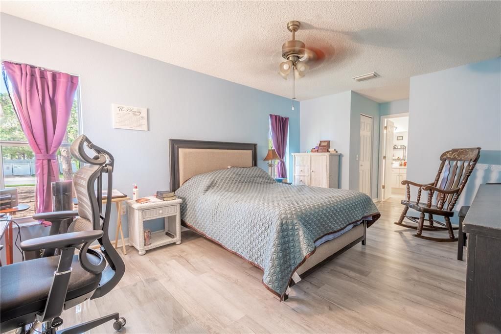 The primary bedroom features luxury vinyl flooring and an ensuite bath.