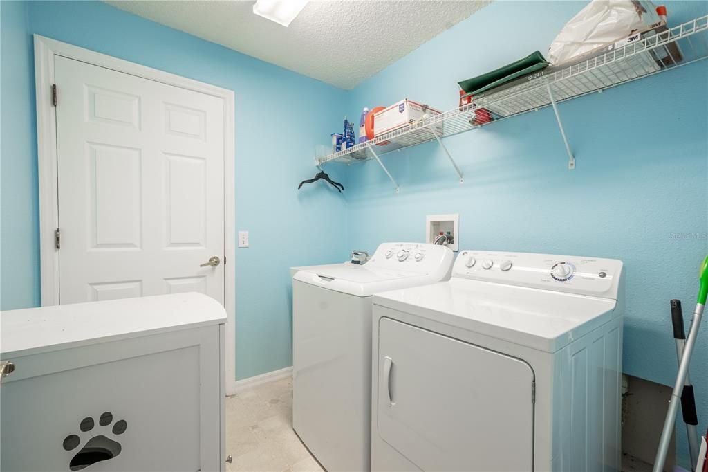 The Laundry room features a washer (new 2024) and dryer with shelving.