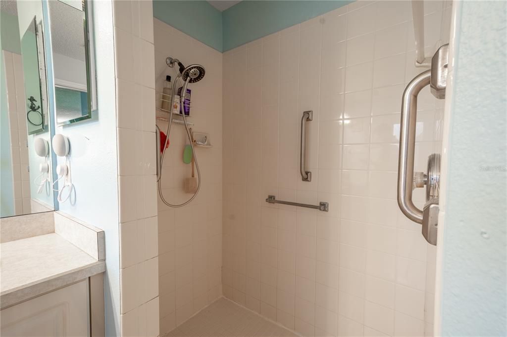 The primary bath features a tiled, walk in shower.