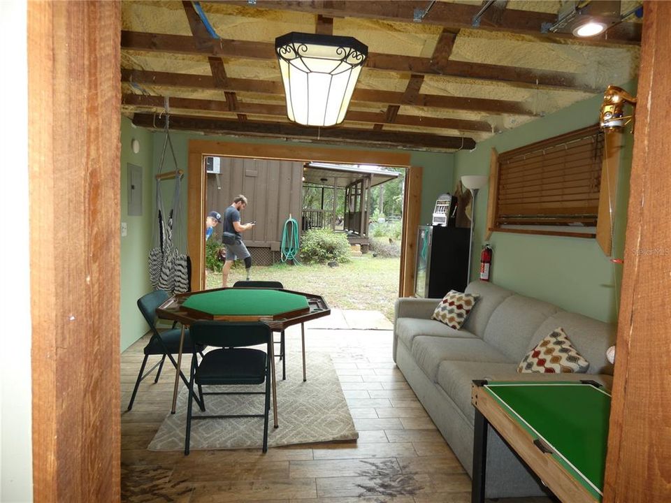 Front shed with converted game room  with AC and remodeled full bathroom with shower.