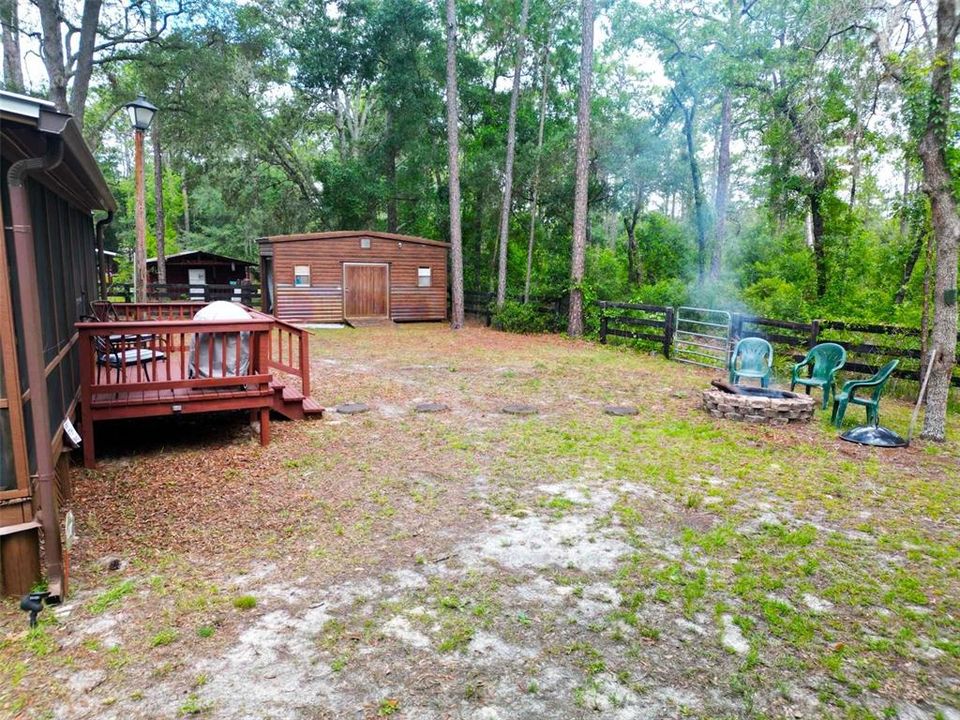 Back yard, fire pit and entry gate to Ocala National Forest in your own back yard.