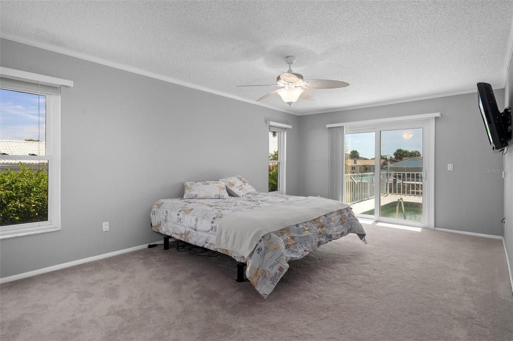 Master Bedroom with sliding doors as well.  Great layout, so many rooms with water views. - New carpet