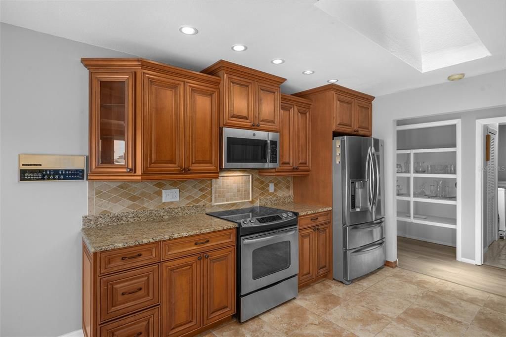 Wood Cabinets - If you prefer cabinets another color, they can be painted to any color you like.  Pantry door can be added if you prefer.   Bright kitchen with skylight