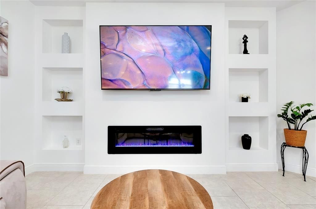 Electric fireplace and custom recessed shelving