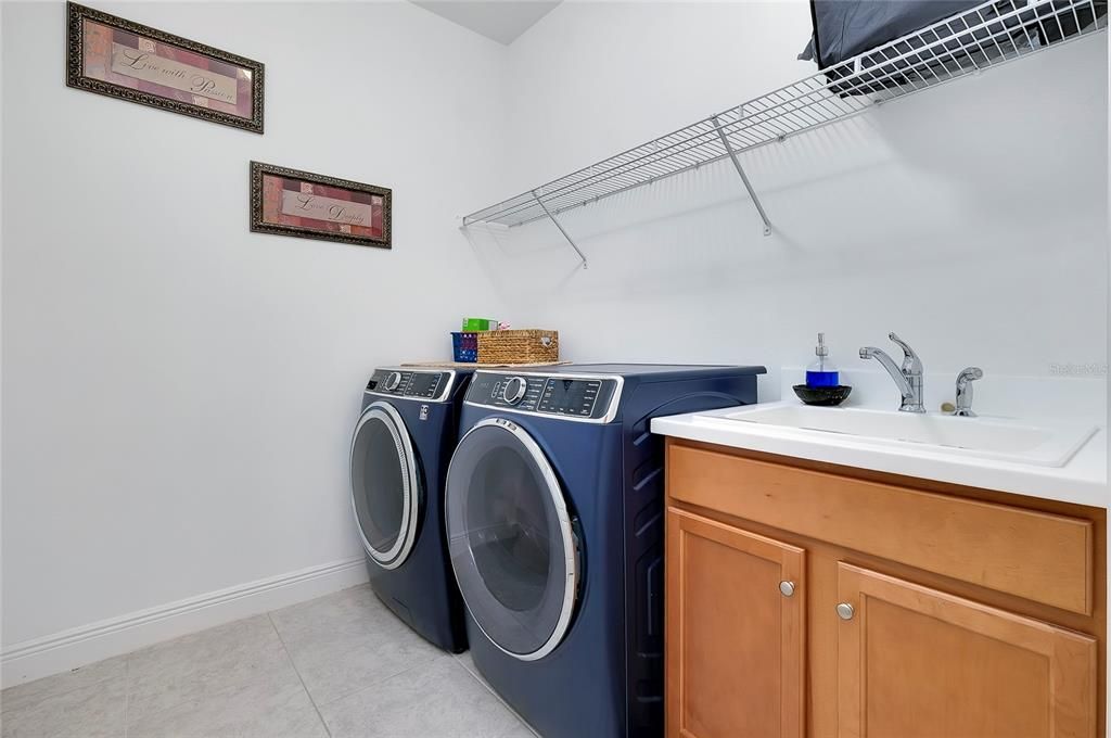 Laundry room with utility sink.