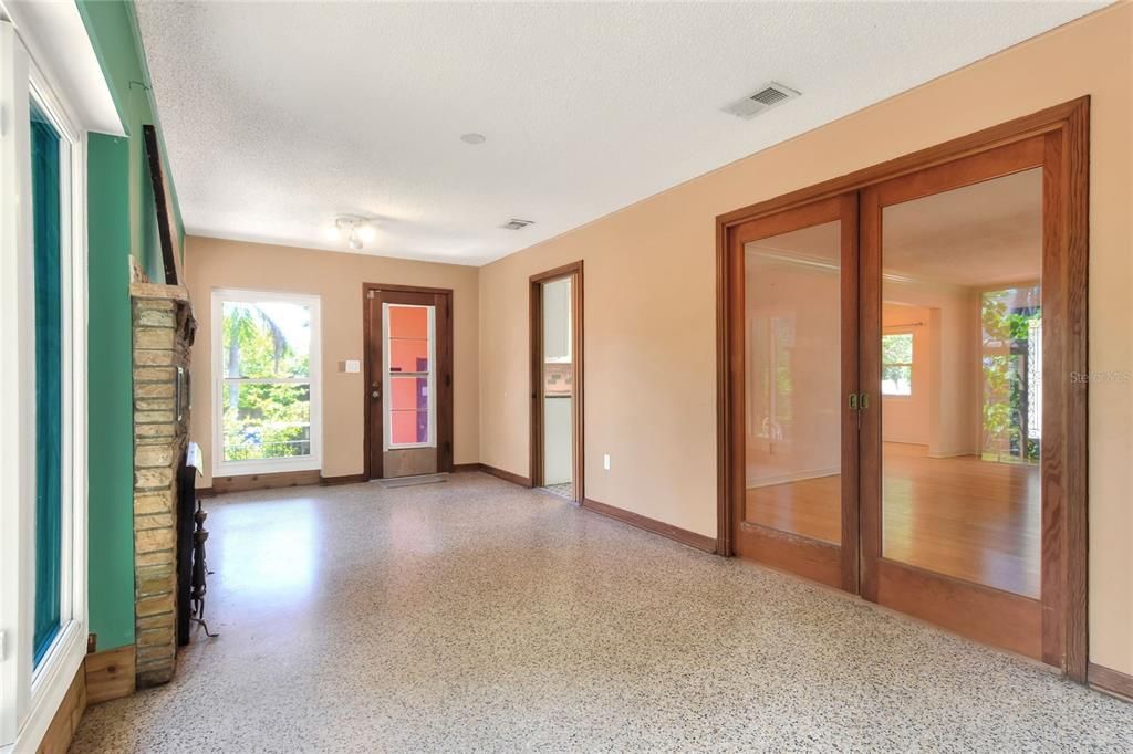 Fireplace in Florida room with wall of windows