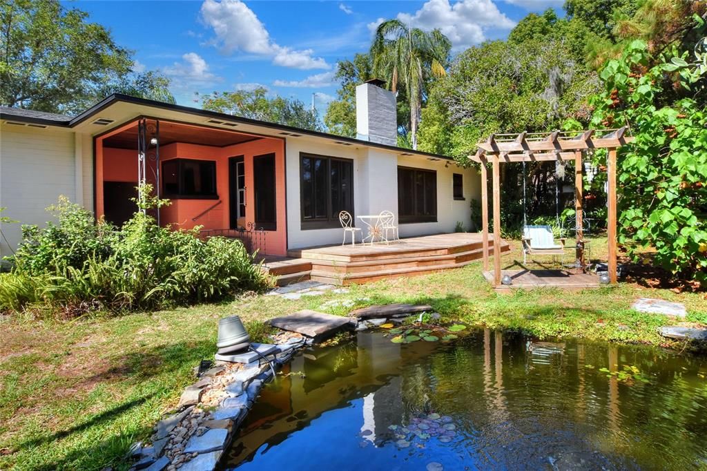 Rear view of house with fish pond