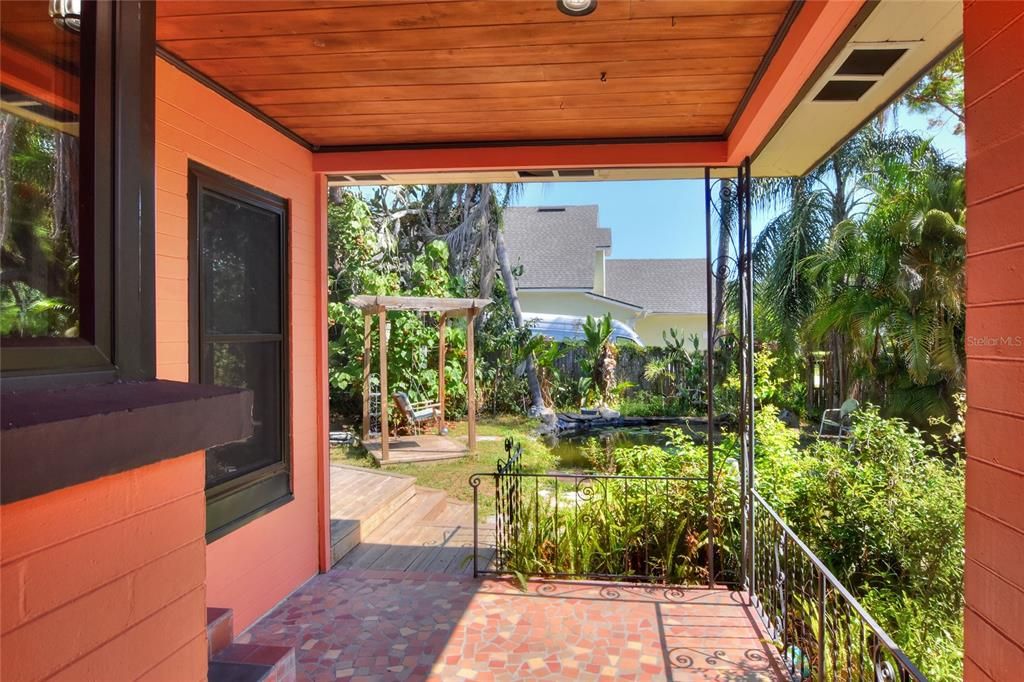 Back porch with cracked tile floor