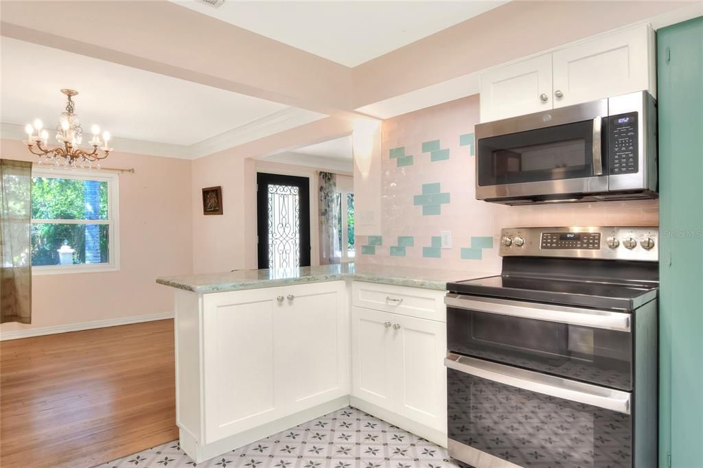 breakfast bar opening to dining room