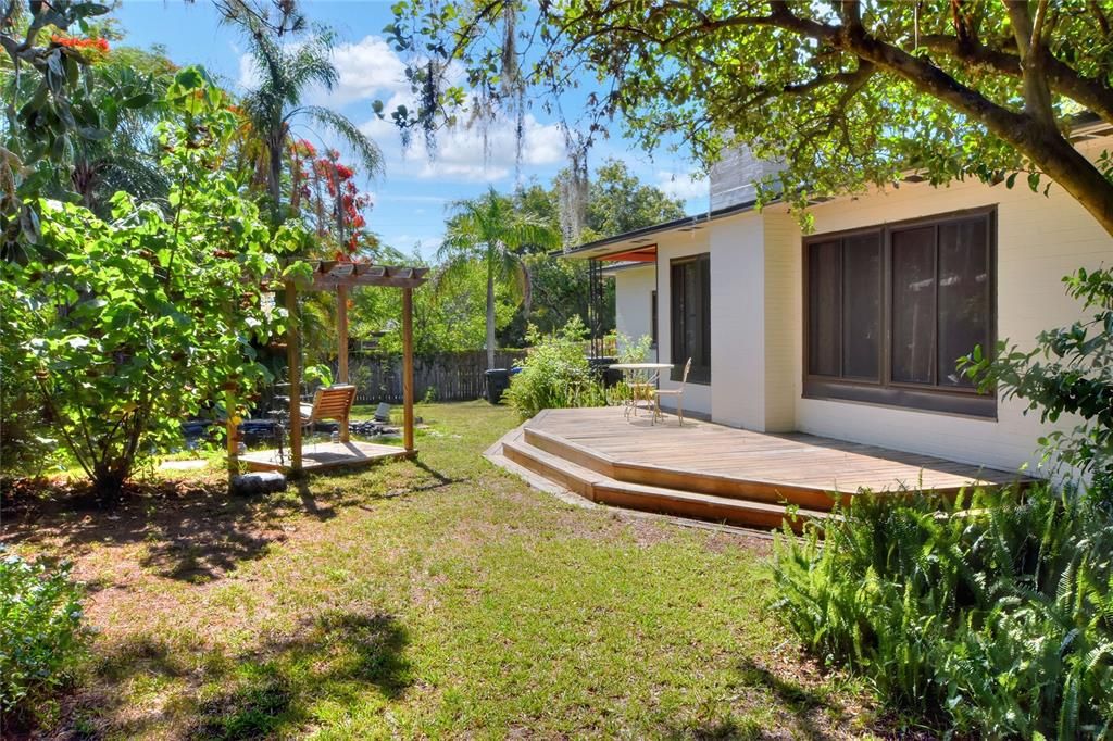 Rear view of house with fish pond