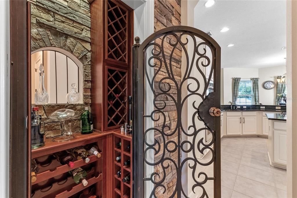 Wine Closet with Storage and Wrought Iron Door