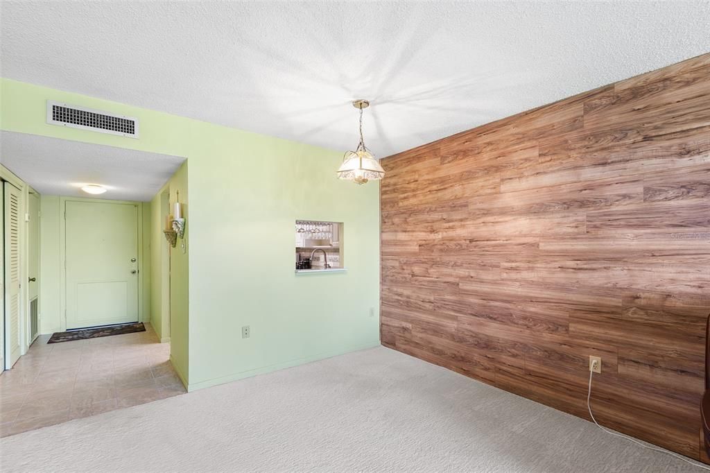 VIEW FROM DINING ROOM/LIVING ROOM TOWARDS FRONT DOOR