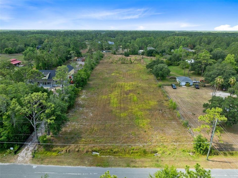 Discover the epitome of opportunity with this expansive 2.17-acre vacant lot nestled in the heart of Cape Orlando Estates/Wedgefield neighborhood.