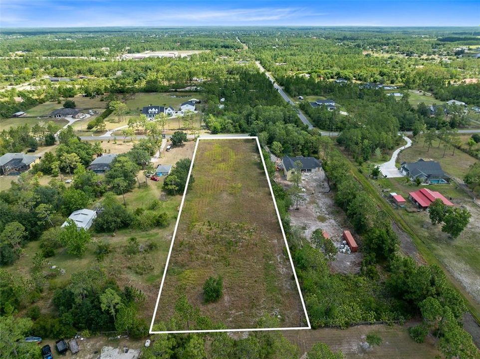 Discover the epitome of opportunity with this expansive 2.17-acre vacant lot nestled in the heart of Cape Orlando Estates/Wedgefield neighborhood.