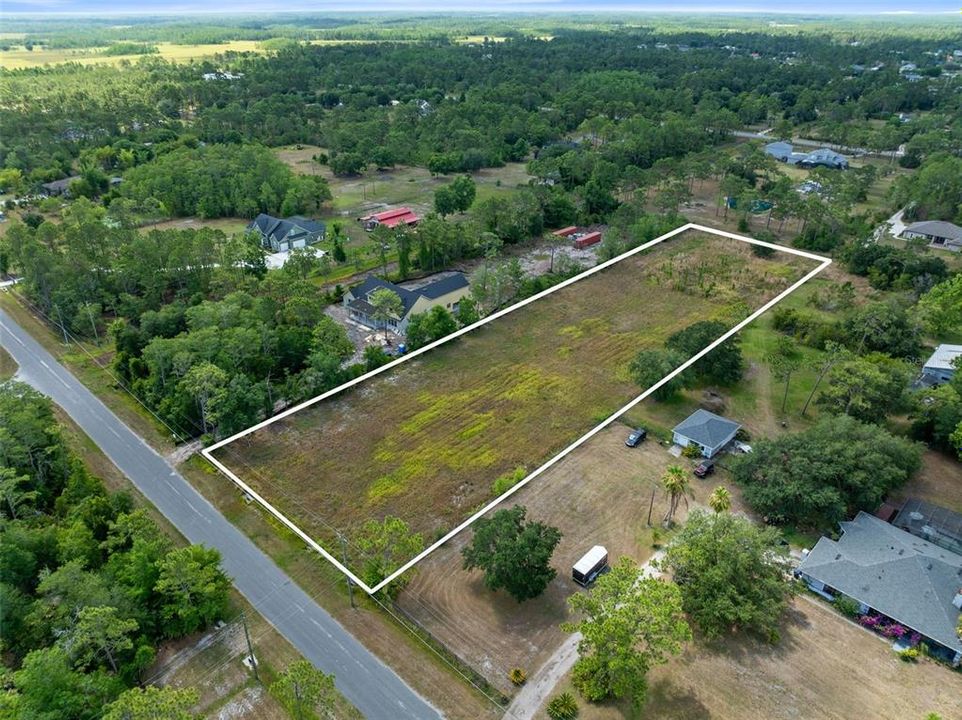 Discover the epitome of opportunity with this expansive 2.17-acre vacant lot nestled in the heart of Cape Orlando Estates/Wedgefield neighborhood.