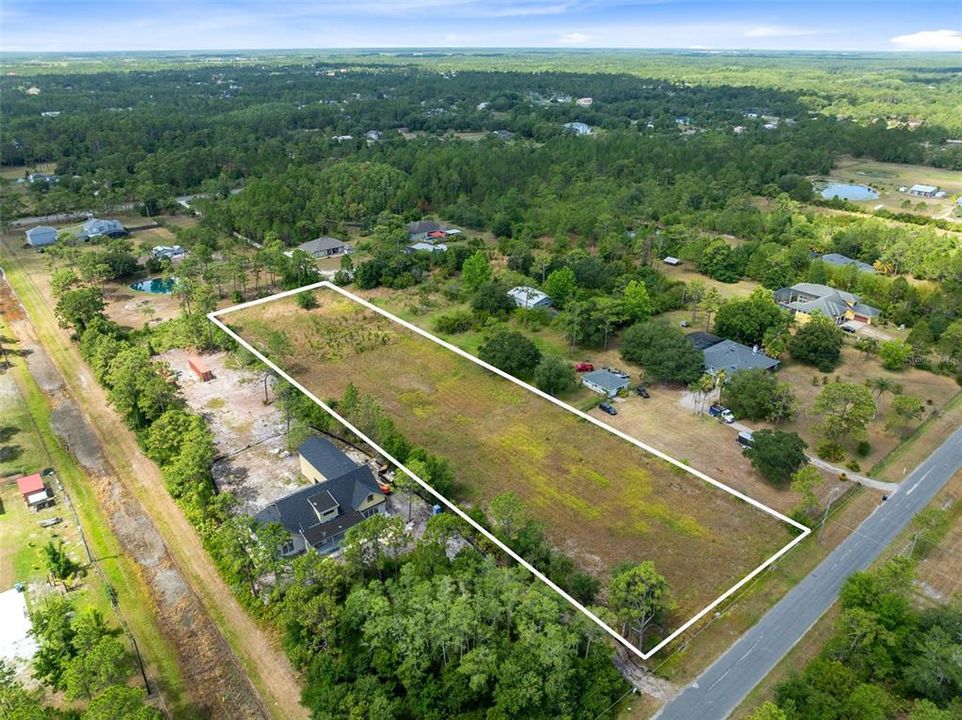 Discover the epitome of opportunity with this expansive 2.17-acre vacant lot nestled in the heart of Cape Orlando Estates/Wedgefield neighborhood.