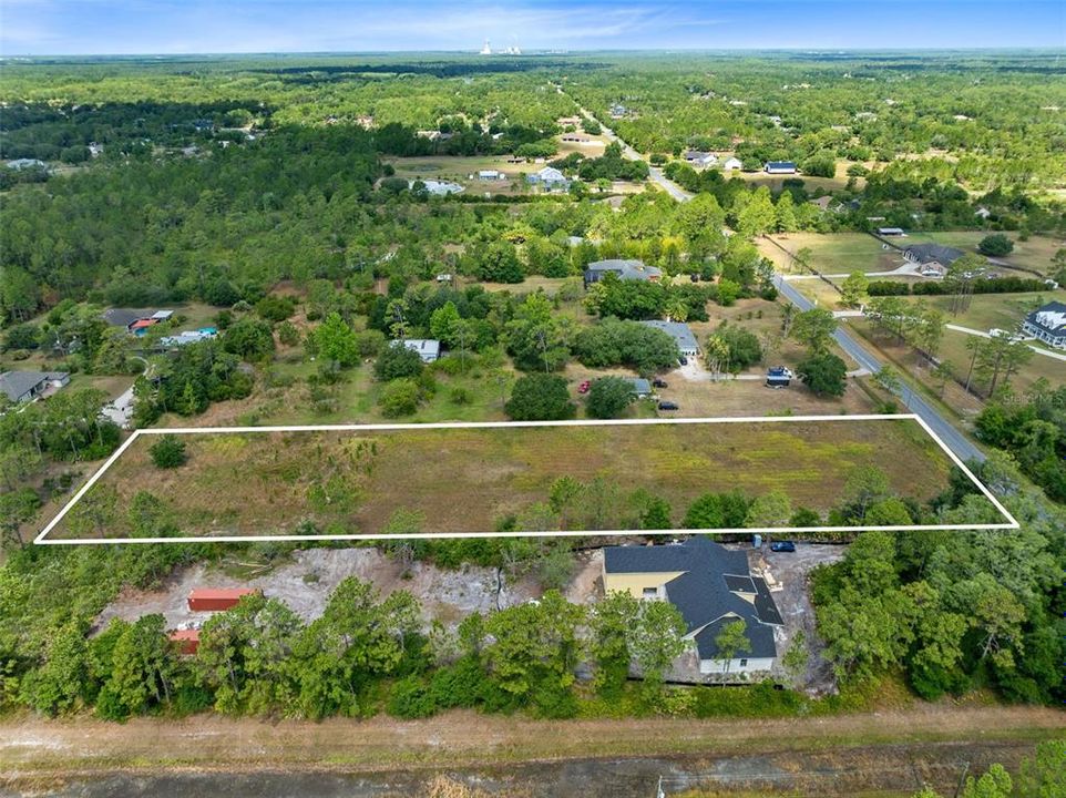 Discover the epitome of opportunity with this expansive 2.17-acre vacant lot nestled in the heart of Cape Orlando Estates/Wedgefield neighborhood.