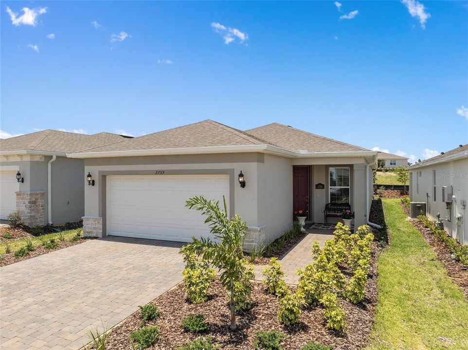 This home offers Great Curb Appeal with the upgraded Stone Accents and a Covered Front Porch