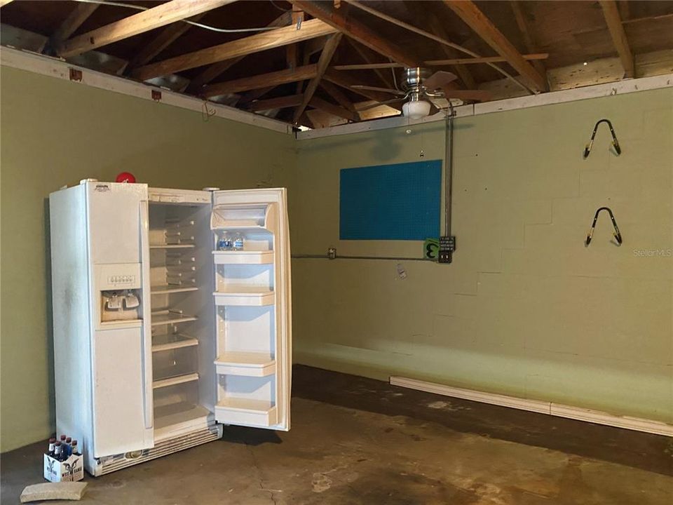 Extra refrigerator in garage