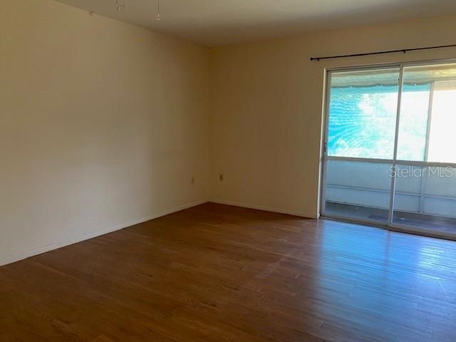 Primary bedroom with dual sliders and walk in closet