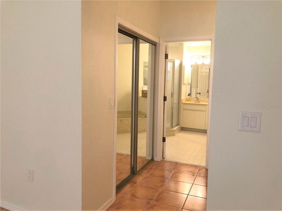 Large walk-in closet in master bedroom.