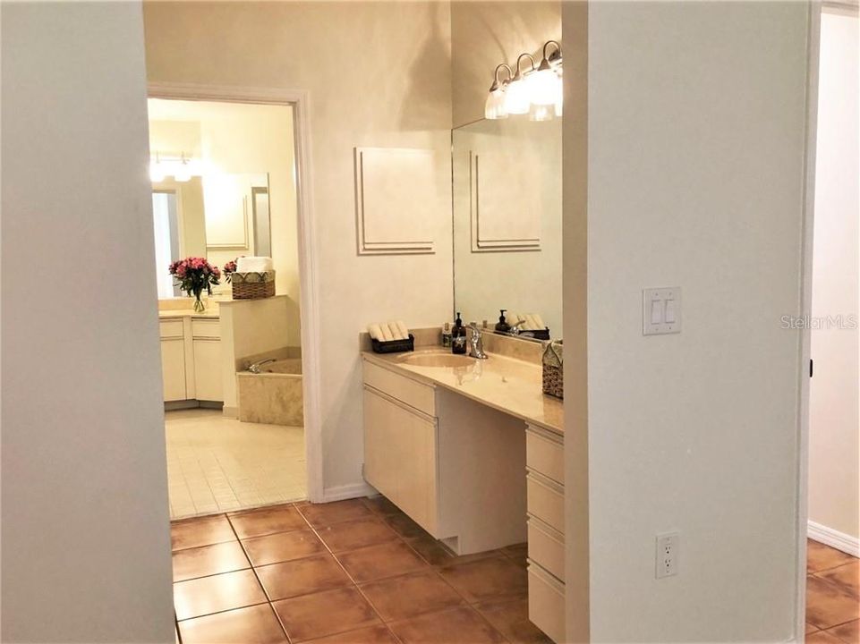 Ensuite bathroom with shower and separate tub.