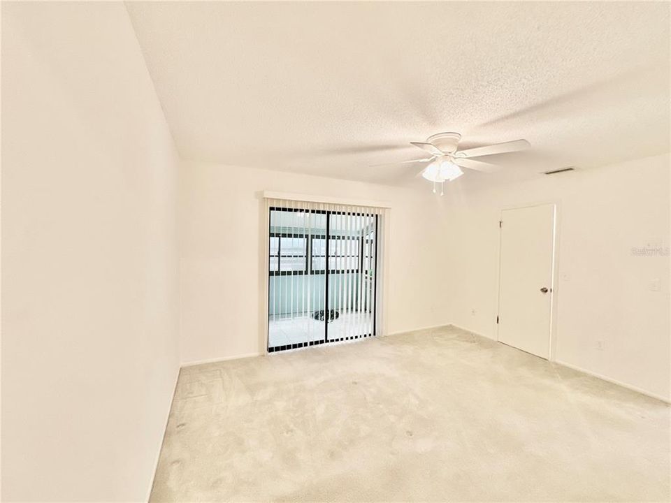 Primary bedroom with private lanai and storage