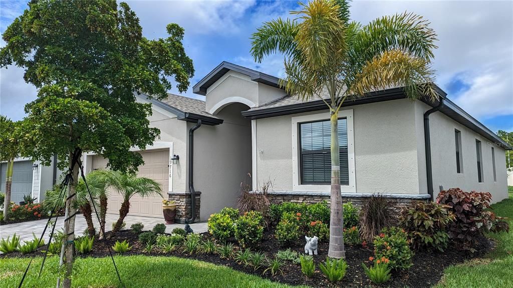 Lovely curb appeal with landscping and new mulch