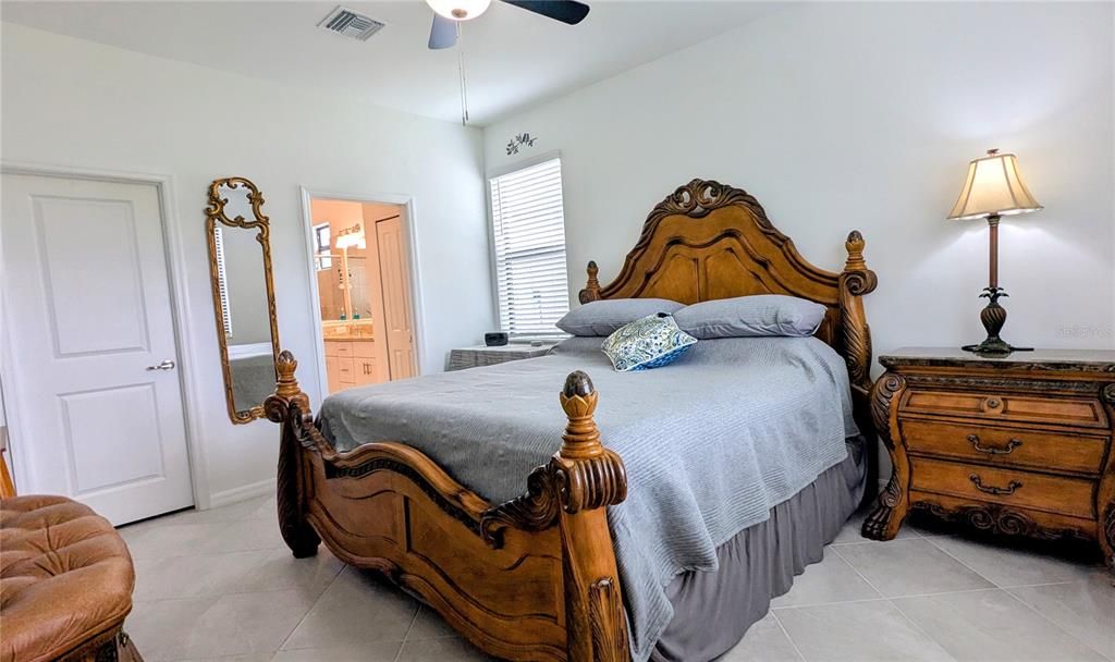 Primary bedroom with ensuite bath and walk-in closet