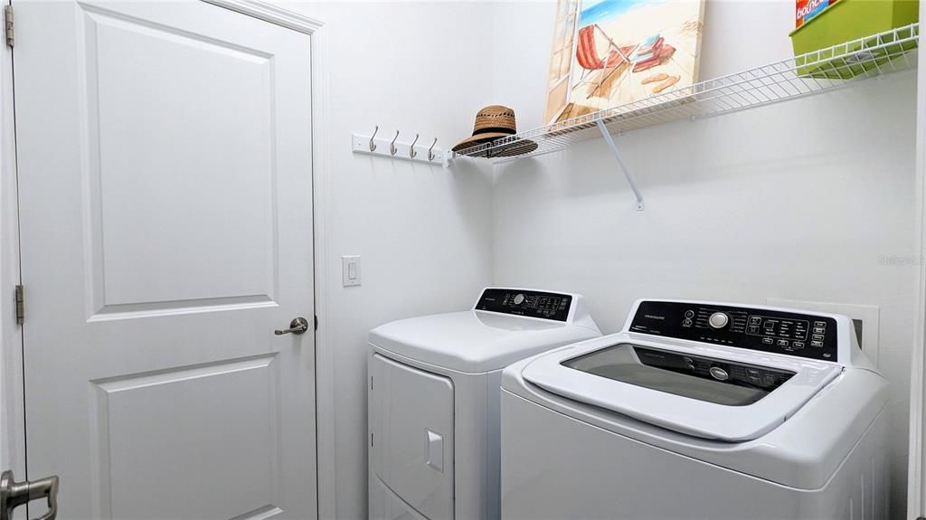 Laundry room with shelving