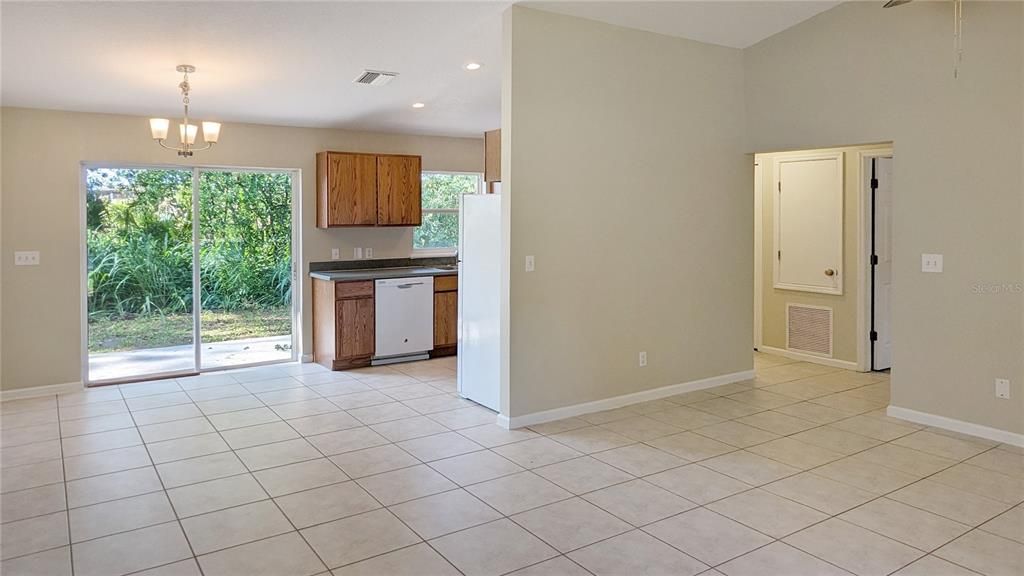 View from Front Door of Living Room Dining Room and Kitchen! Bedroom and full bath thru the archway on Right Side of picture!