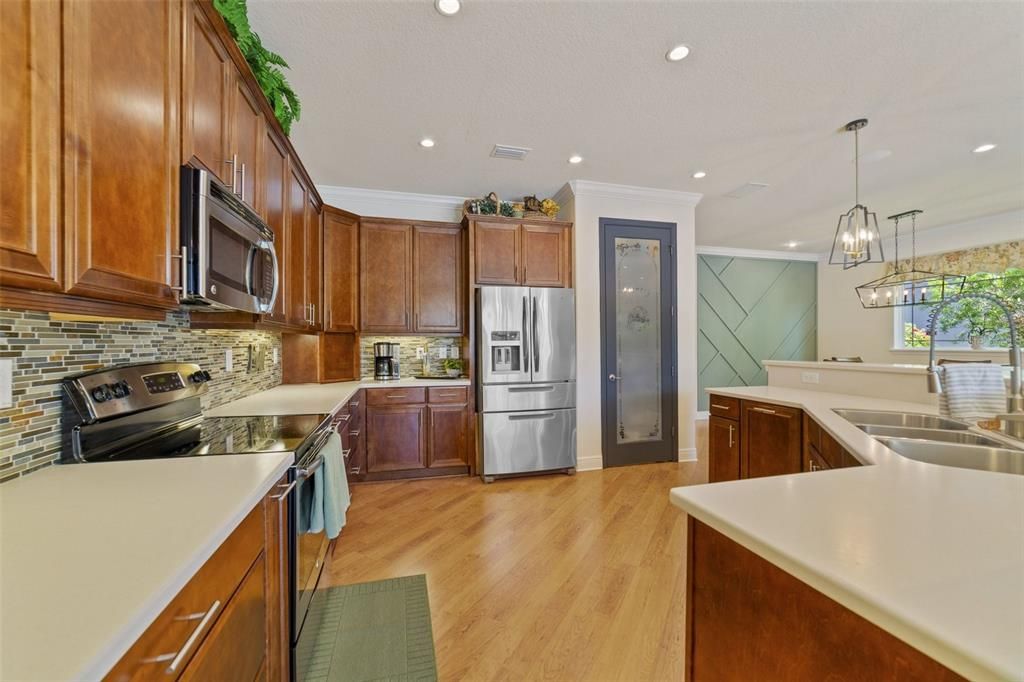 The family chef will fall in love with the well appointed kitchen offering a great mix of cabinet and drawer storage complete with spice racks on both sides of the stove, lazy susan’s and soft close.