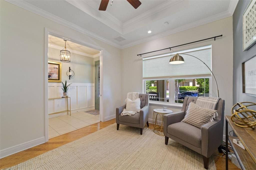 There are WOOD LAMINATE FLOORS throughout your main living areas starting in the flexible DEN/OFFICE off the foyer featuring crown molding and a tray ceiling if you need a more formal space while the modern take on the neutral color palette keeps it comfortable and inviting.