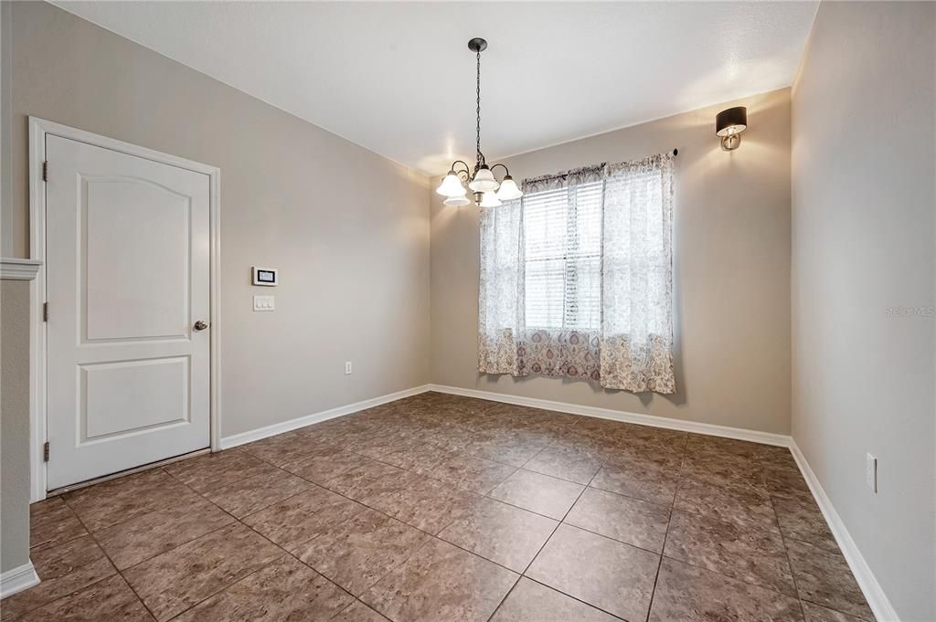 Dinette by the kitchen and door to garage