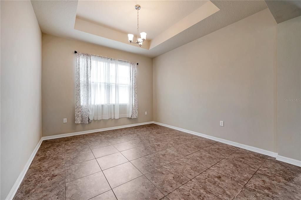 Nice tray ceiling in front bedroom that could be setup as an office